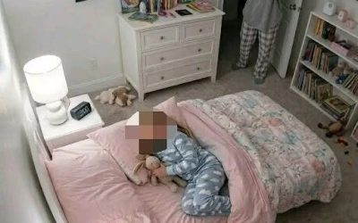 My 8-year-old kept telling me her bed felt “too tight.” At 2:00 a.m., the camera finally showed me why… For three weeks my daughter Mia kept saying the same strange sentence before bed. “Mom… my bed feels too tight.” At first I thought it was just one of those odd phrases kids invent when they can’t explain discomfort. Mia was eight years old, imaginative, and sometimes dramatic when she didn’t want to sleep. “What do you mean tight?” I asked one night while tucking her blanket. She shrugged. “It just feels like something is squeezing it.” I pressed the mattress with my hand. It felt normal. “You’re probably growing,” I said. “Beds can feel smaller when you get taller.” She didn’t look convinced. That night she woke up around midnight and walked into my room. “My bed is tight again.” I checked the mattress, the frame, the sheets—everything looked perfectly normal. My husband Eric laughed when I told him. “She just doesn’t want to sleep alone.” But Mia kept insisting. Every night. “It feels tight.” After a week I replaced the mattress entirely, thinking maybe the springs were damaged. The new one arrived two days later. For exactly one night, Mia slept peacefully. Then the complaints started again. “Mom… it’s happening again.” That’s when I installed a small security camera in her bedroom. At first I told myself it was just for peace of mind. Mia had always been a restless sleeper, and maybe she was simply kicking the mattress frame during the night. The camera connected to an app on my phone so I could check the room anytime. For the first few nights, nothing unusual happened. Mia slept normally. The bed didn’t move. But on the tenth night I woke up suddenly. The digital clock read 2:00 a.m. My phone vibrated with a notification. Motion detected – Mia’s room. Half awake, I opened the camera feed. The night vision image showed Mia sleeping on her side under the blanket. Everything looked quiet. Then the mattress moved. Just slightly. As if something underneath it had shifted. My stomach tightened. Because Mia’s bed didn’t have storage drawers. There was nothing under it except the wooden floor. But on the camera… Something was clearly moving…To be continued in C0mments 👇
