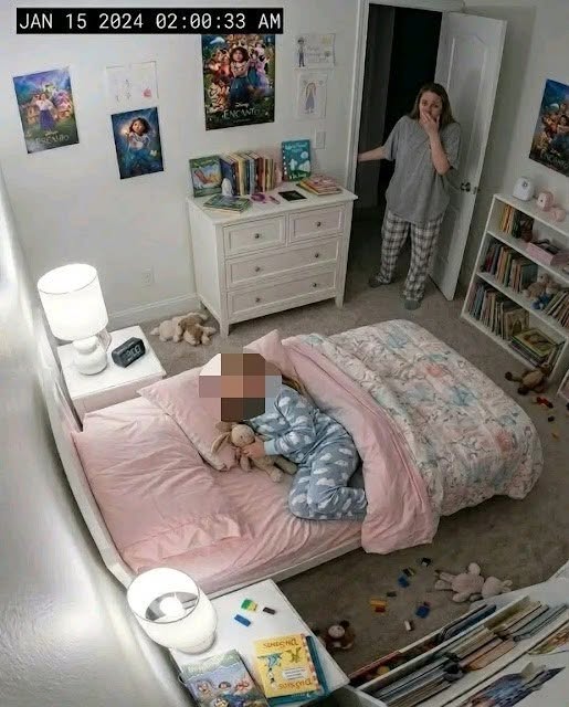 My 8-year-old kept telling me her bed felt “too tight.” At 2:00 a.m., the camera finally showed me why… For three weeks my daughter Mia kept saying the same strange sentence before bed. “Mom… my bed feels too tight.” At first I thought it was just one of those odd phrases kids invent when they can’t explain discomfort. Mia was eight years old, imaginative, and sometimes dramatic when she didn’t want to sleep. “What do you mean tight?” I asked one night while tucking her blanket. She shrugged. “It just feels like something is squeezing it.” I pressed the mattress with my hand. It felt normal. “You’re probably growing,” I said. “Beds can feel smaller when you get taller.” She didn’t look convinced. That night she woke up around midnight and walked into my room. “My bed is tight again.” I checked the mattress, the frame, the sheets—everything looked perfectly normal. My husband Eric laughed when I told him. “She just doesn’t want to sleep alone.” But Mia kept insisting. Every night. “It feels tight.” After a week I replaced the mattress entirely, thinking maybe the springs were damaged. The new one arrived two days later. For exactly one night, Mia slept peacefully. Then the complaints started again. “Mom… it’s happening again.” That’s when I installed a small security camera in her bedroom. At first I told myself it was just for peace of mind. Mia had always been a restless sleeper, and maybe she was simply kicking the mattress frame during the night. The camera connected to an app on my phone so I could check the room anytime. For the first few nights, nothing unusual happened. Mia slept normally. The bed didn’t move. But on the tenth night I woke up suddenly. The digital clock read 2:00 a.m. My phone vibrated with a notification. Motion detected – Mia’s room. Half awake, I opened the camera feed. The night vision image showed Mia sleeping on her side under the blanket. Everything looked quiet. Then the mattress moved. Just slightly. As if something underneath it had shifted. My stomach tightened. Because Mia’s bed didn’t have storage drawers. There was nothing under it except the wooden floor. But on the camera… Something was clearly moving…To be continued in C0mments 👇
